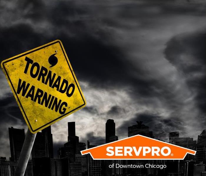 A tornado warning sign leans towards a major city with a tornado forming in the background.