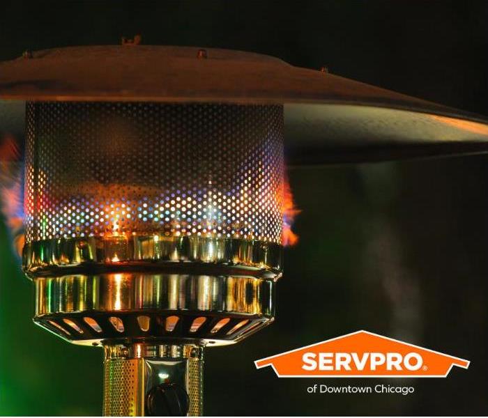 An outdoor patio heater powered by propane is shown.