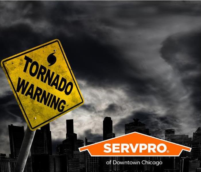 A tornado warning sign leans towards a major city with a tornado forming in the background.